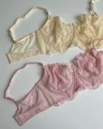 gentle-pink-and-beige-lace-bustier-bras-without-foam-with-bows-on-the-white-background