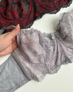 hand-is-holding-gentle-grey-lace-bustier-bra-without-foam-with-a-bow-D-cup