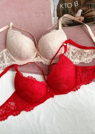 tempting-beige-and-red-lace-classic-bras-with-push-up-bows-and-belts-with-a-magazine-nearby