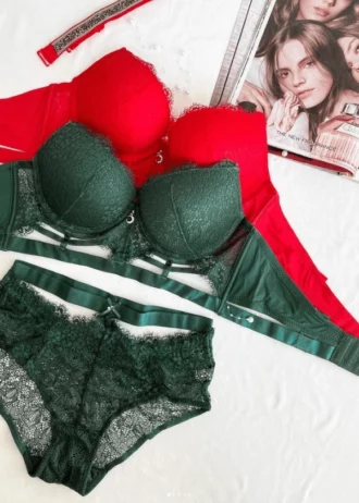 red-and-green-lace-sets-of-bustier-bras-with-push-up-and-high-wasted-panties-with-belts-and-chokers-bundled-with-pearls-and-a-magazine-on-the-background