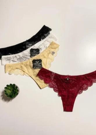 red-black-white-and-beige-thongs-with-lace-incisions-and-bows-Coeur-Joie-with-a-plant