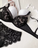 white-and-black-and-beige-sets-of-underwear-with-beautiful-lace-pattern-and-a-magazine-on-the-background