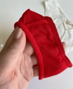 the-inner-side-of-a-smooth-red-high-waisted-tanga-panties-with-a-golden-belt