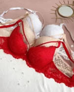 tempting-white-beige-and-red-lace-classic-bras-with-push-up-bows-and-belts-with-the-mirror-nearby