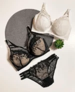 tempting-black-and-beige-and-white-sets-of-bras-and-panties-with-gentle-flower-pattern-mesh-and-belts-with-a-plant-nearby