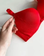 hand-is-holding-a-red-smooth-bra-with-lace-on-the-edge-and-push-up-for-D-cup