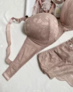 beige-bra-with-beutiful-lace-pattern-and-panties-bundled-having-a-magazine-on-the-background