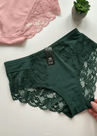 hand-is-holding-green-and-powdery-cotton-high-waisted-slips-with-pieces-of-lace