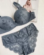 light-blue-set-of-underwear-with-beutiful-lace-pattern-with-a-magazine-on-the-background