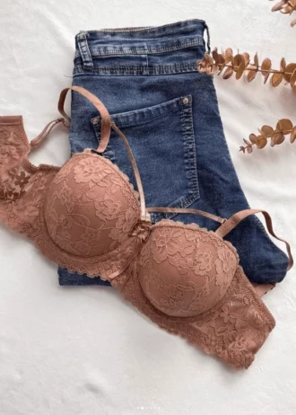 beautiful-dark-beige-lace-balconette-bra-without-push-up-and-with-a-bow-and-belts-on-the-jeans-with-an-artifical-branch-nearby