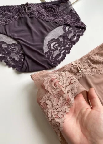 hand-is-holding-beautiful-beige-and-dark-purple-lace-high-waisted-panties-with-mesh