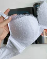 hand-is-holding-a-tempting-white-lace-classic-bra-with-thin-push-up-D-cups