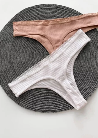 the backside of cute white and beige cotton thongs in a ribbed design