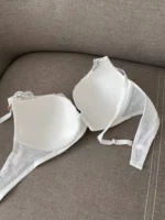 the backside of a basic lace white bra C cups