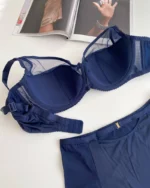 the backside of a luxurious smooth blue bra with thin foam and D cups with mesh and smooth high-waisted panties Lanny Mode